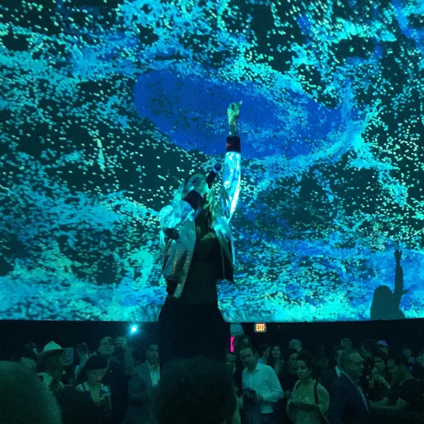 R&B artist Abra performing in a planetarium dome.