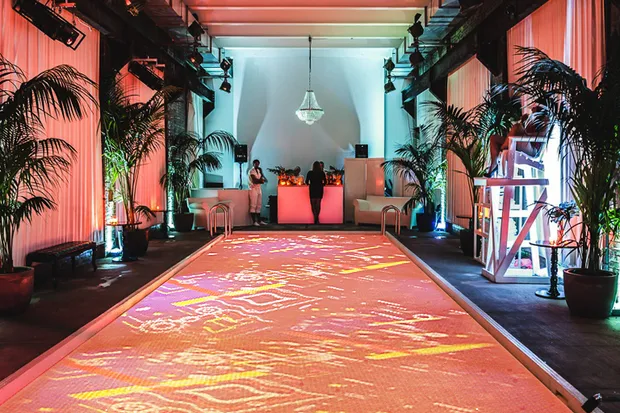 An indoor pool with a surface covered in ping pong balls.